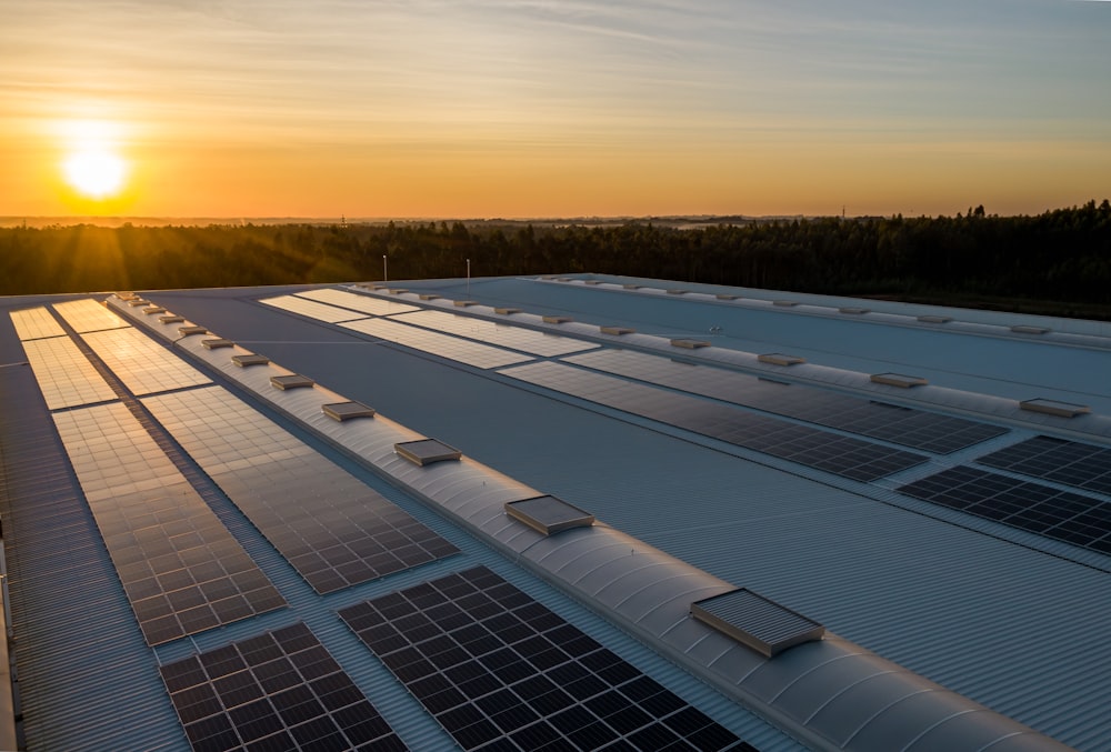 Solar panels on a rooftop at sunset